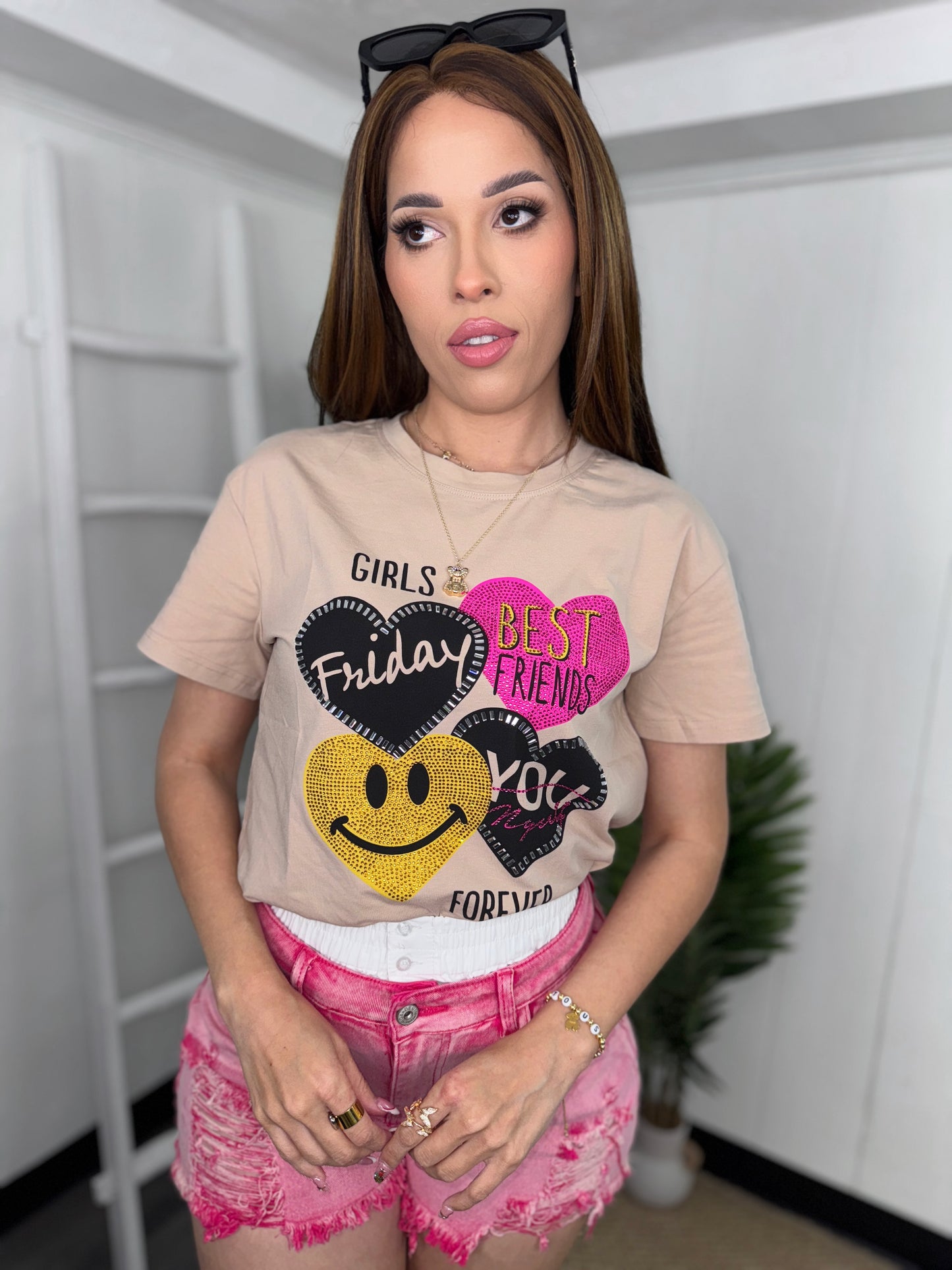 Model wearing trendy graphic tee with fun print, perfect for casual styling.