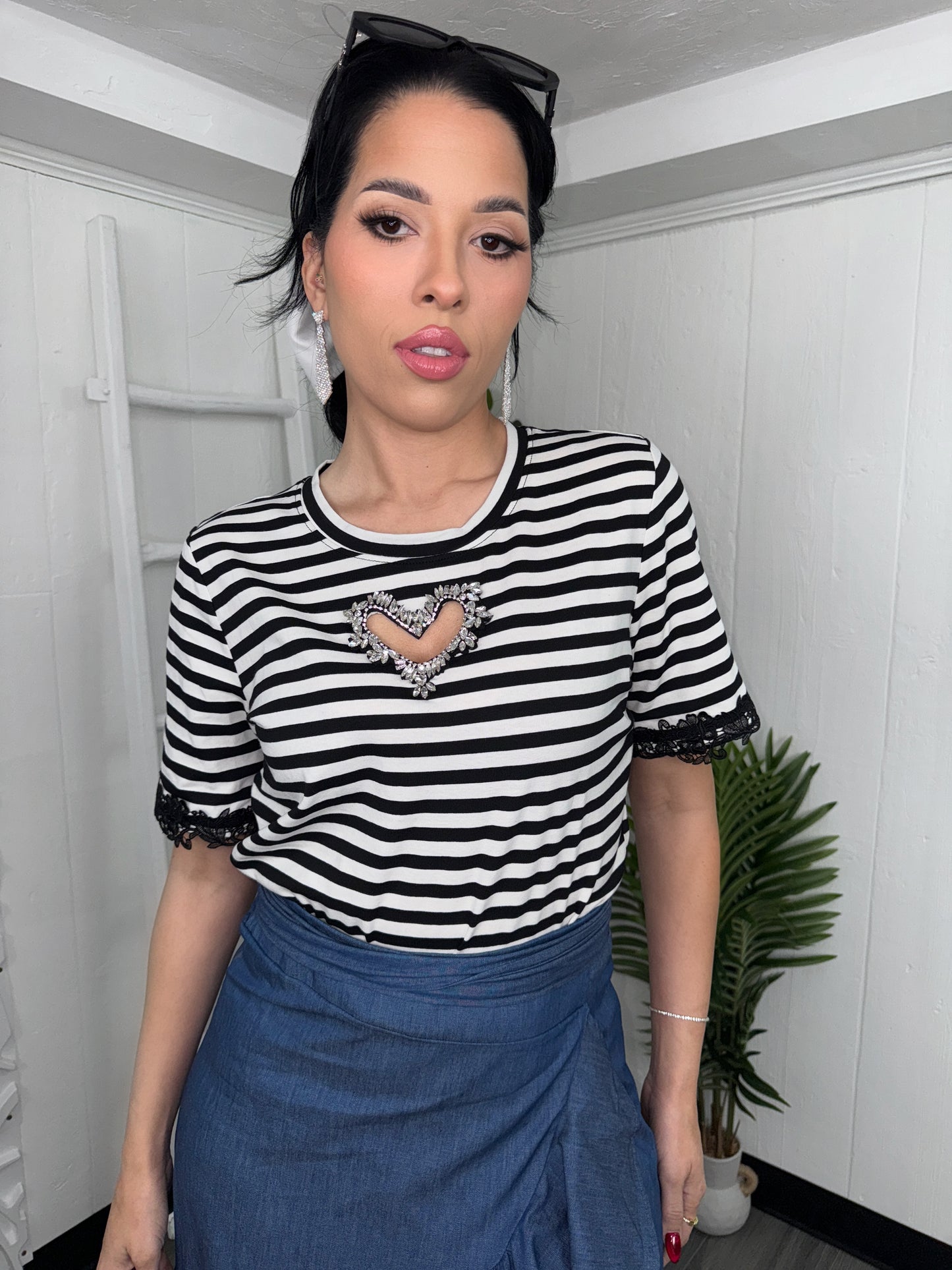 Front view of Heart Line Top paired with a blue skirt, Model - S.