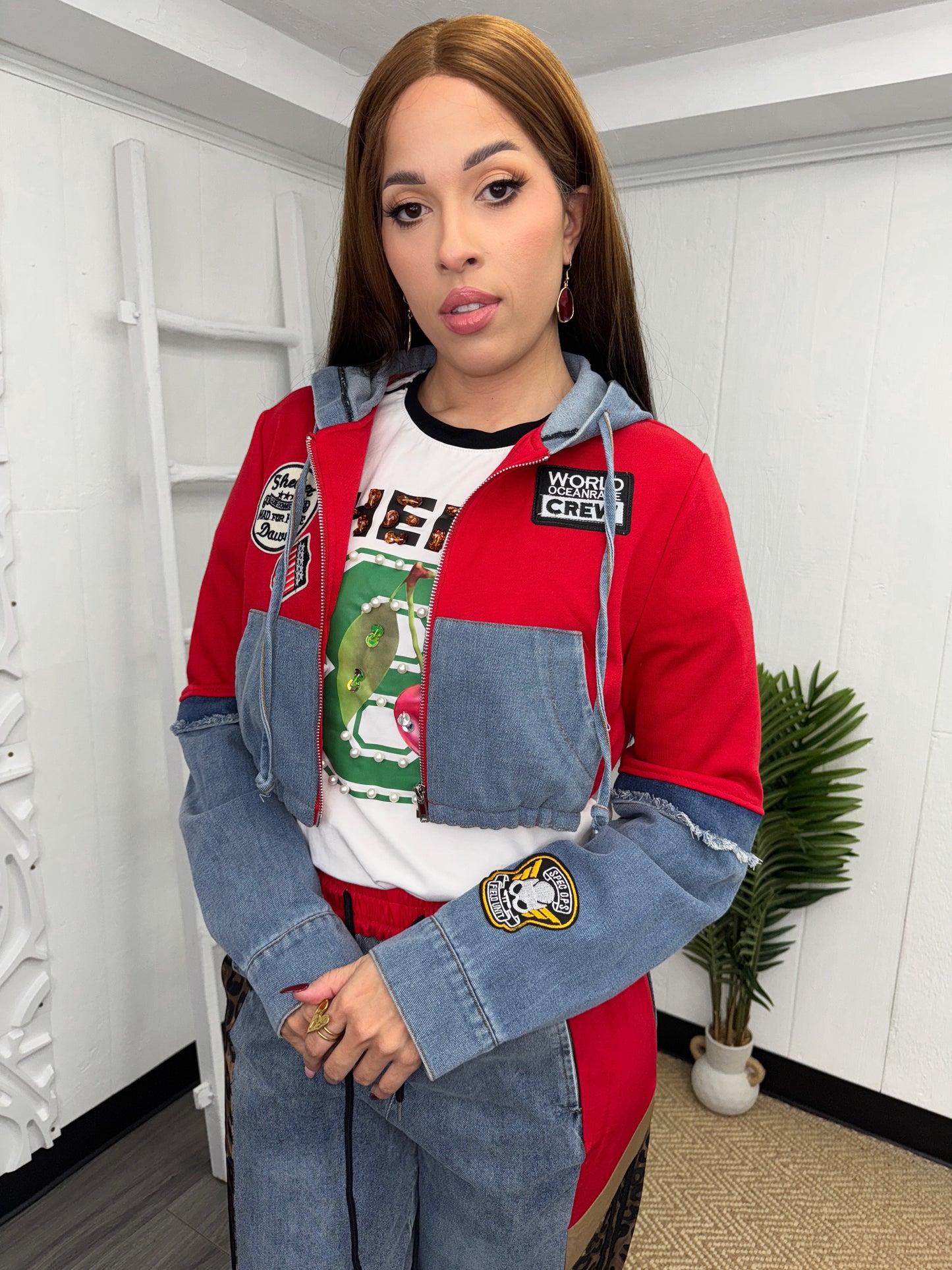 Model wearing a denim crop hoodie with patchwork details, perfect for casual and edgy outfits.