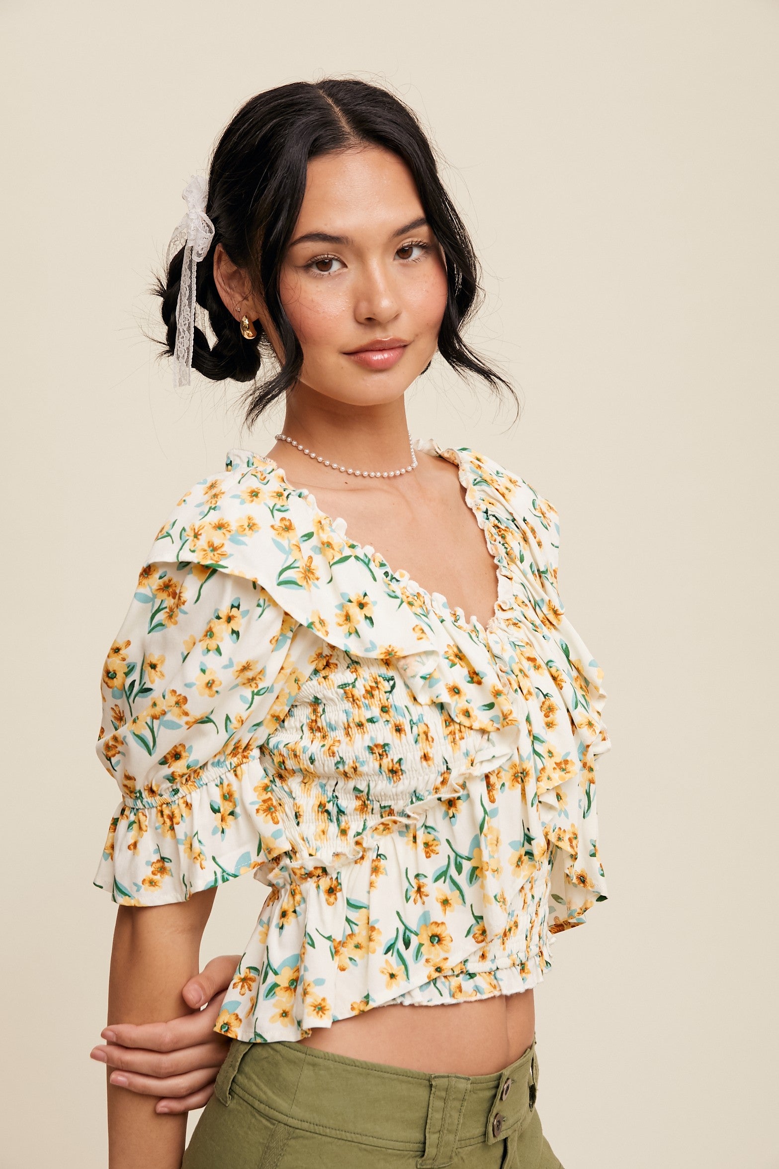 Flower Print Ruffled V-neck Blouse with lightweight fabric and elegant ruffles for a casual chic look.