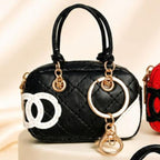 Mini bag charm acolchado negro con blanco