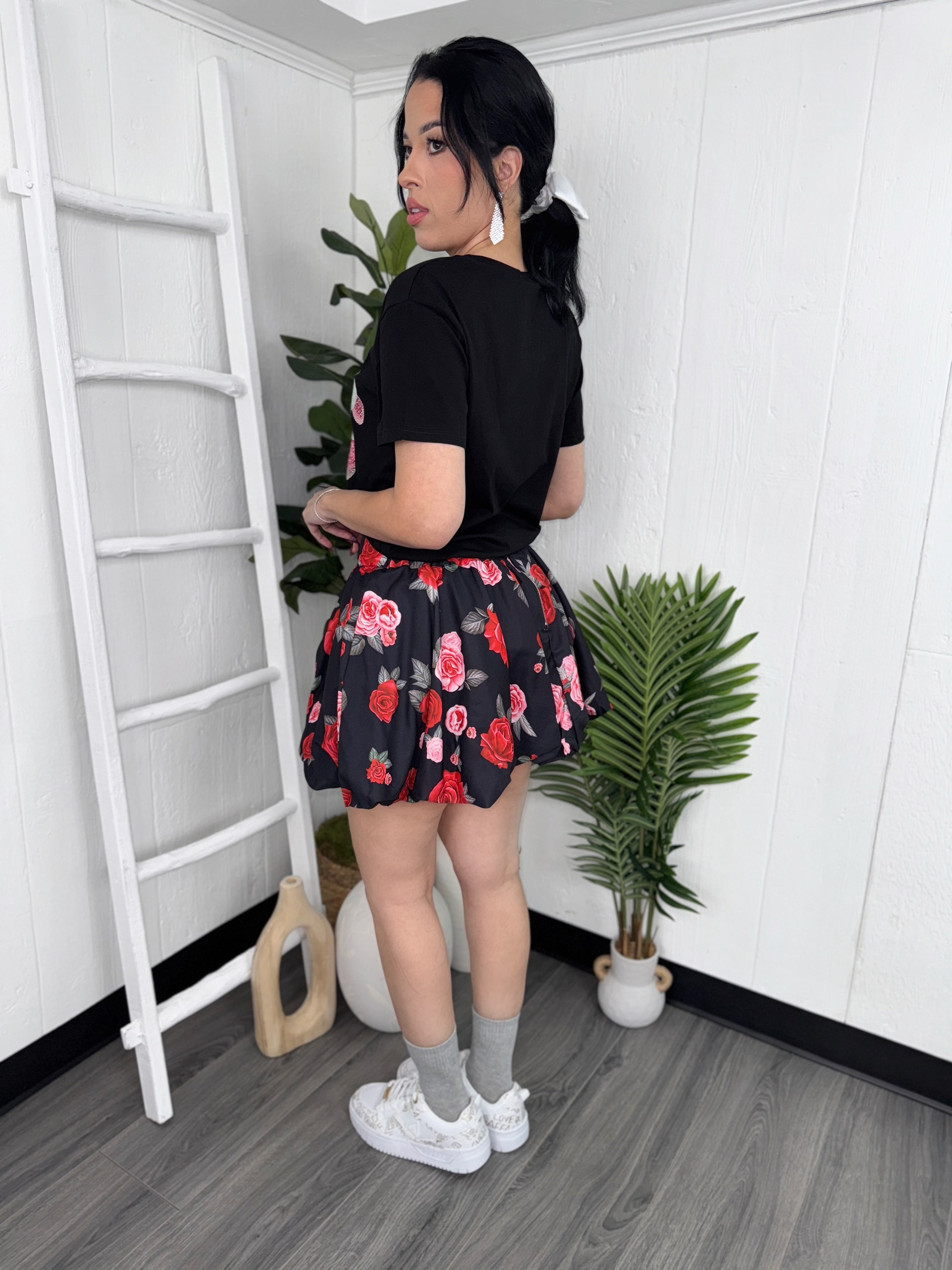 Side view of Flower Skirt showing the floral design, Model - Small