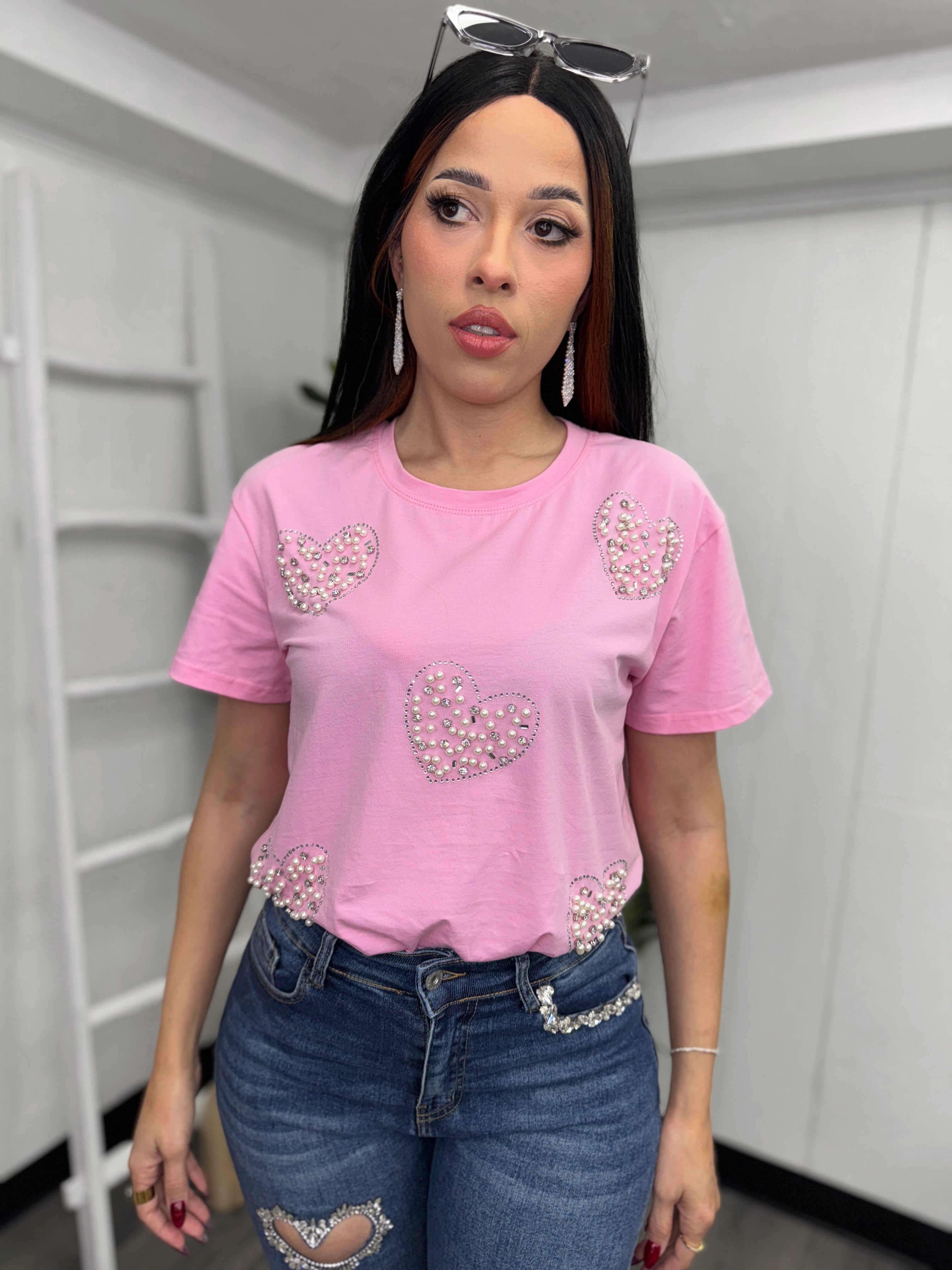 Front view of Pink Heart Rhinestone Blouse paired with jeans, Model - Small.
