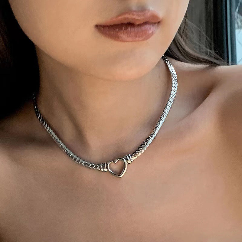 Stainless Steel Heart Chain Necklace close-up.
Model showcasing Minimalist Heart Necklace.