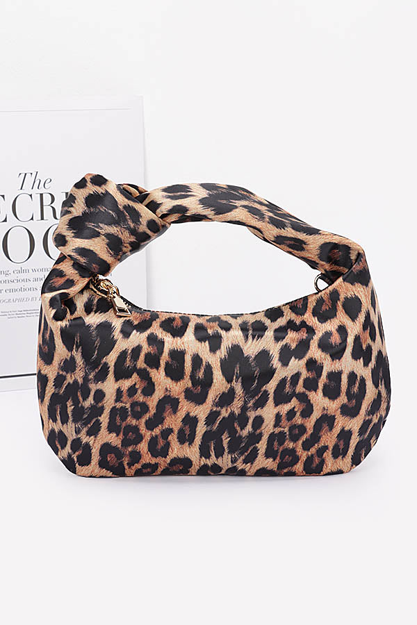 Side view of leopard print knot shoulder bag.